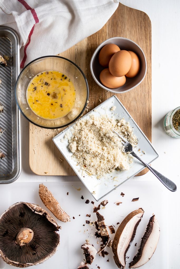 ingredients to make portobello mushroom fries laid out on a table