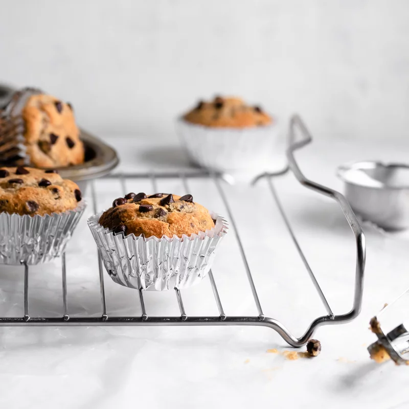 Chocolate chip muffins on a baking rack