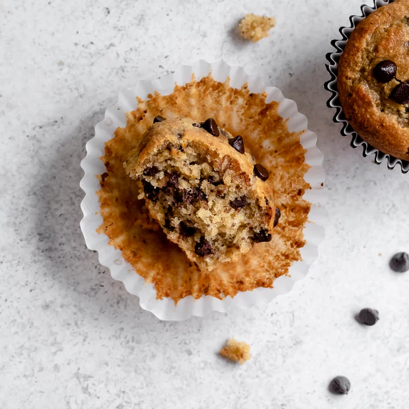 A chocolate chip muffin with a bite taken
