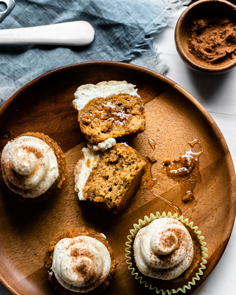 Muffin sliced open on a wooden plate