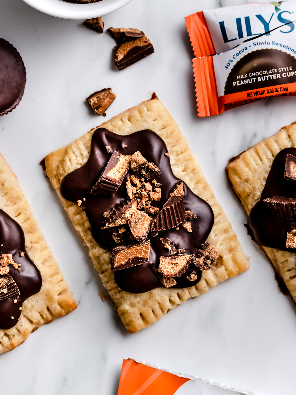 A gluten free pop tart topped with broken peanut butter cups